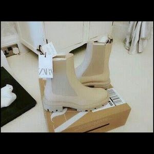 Zara boots. True to size. If you’re an eight these will be too small.